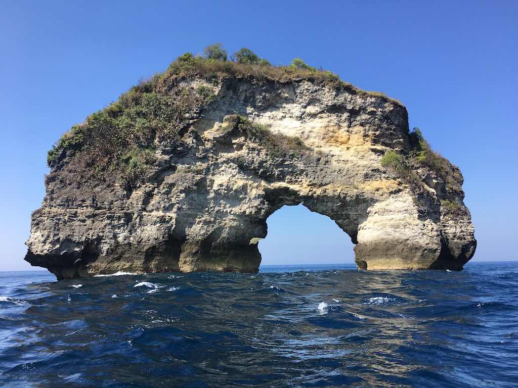 Batu Bolong di depan Tebing Banah Cliff